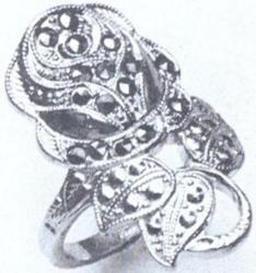 Marcasites in solid Sterling Silver ring with rose motif from 1920's are hand-cut and faceted.